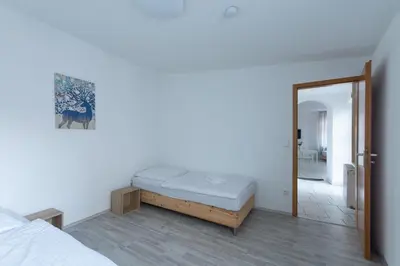Ein Bett oder Betten in einem Zimmer der Unterkunft T&K Apartments - 1-3 Zimmer Apartments - Essen