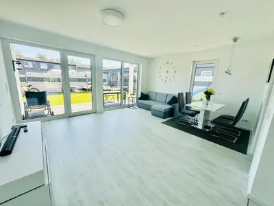 Ein Sitzbereich in der Unterkunft Neue Doppelhaushälfte mit Terrasse, Balkon und Garten