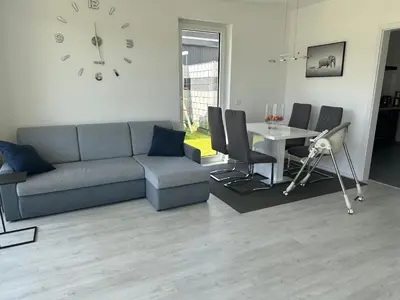 Ein Sitzbereich in der Unterkunft Neue Doppelhaushälfte mit Terrasse, Balkon und Garten