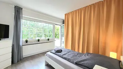 Ein Bett oder Betten in einem Zimmer der Unterkunft Modern 6-Bedroom Apartment with Rooftop Terrace, free Wi-Fi and Parking- MND01