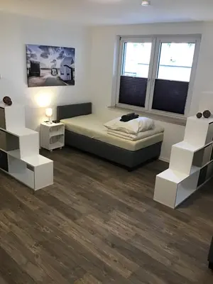 Ein Bett oder Betten in einem Zimmer der Unterkunft VerwöhnWohnungDeluxe