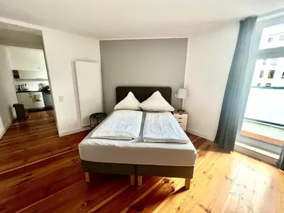 Ein Bett oder Betten in einem Zimmer der Unterkunft Vibehome Düsseldorf - Stresemannstraße