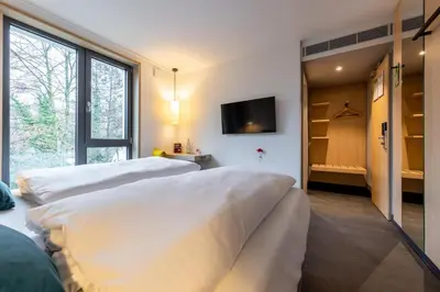 Ein Bett oder Betten in einem Zimmer der Unterkunft Serways Hotel Hösel