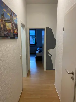Ein Bett oder Betten in einem Zimmer der Unterkunft WORK & TRAVEL Apartment - Gratis NETFLIX - seht gute Verkehrsanbindung