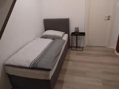 Ein Bett oder Betten in einem Zimmer der Unterkunft Ruhige Nachbarschaft