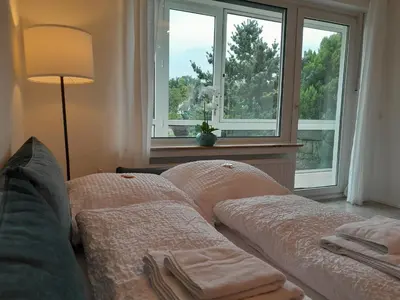 Ein Bett oder Betten in einem Zimmer der Unterkunft 4-Zimmer-Ferienwohnung, modern, Küche, WLAN, Netflix