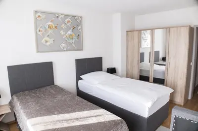 Ein Bett oder Betten in einem Zimmer der Unterkunft T&K Apartments near Messe Fair Trade Düsseldorf und Airport 1B
