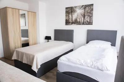 Ein Bett oder Betten in einem Zimmer der Unterkunft T&K Apartments near Messe Fair Trade Düsseldorf und Airport 2A