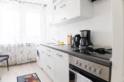 Küche/Küchenzeile in der Unterkunft T&K Apartments near Messe Fair Trade Düsseldorf und Airport 2A