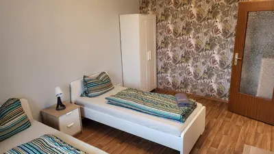 Ein Bett oder Betten in einem Zimmer der Unterkunft HOME at FRIENDS - City - Zu Hause bei Freunden