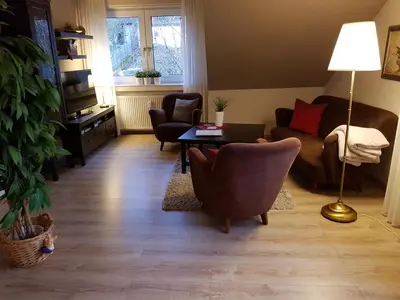 Ein Sitzbereich in der Unterkunft Haus Homann-Schneider, Apartment Stefan