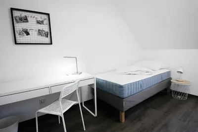 Ein Bett oder Betten in einem Zimmer der Unterkunft SH Team Lodges 4 Apartments für max 19 Personen l Monteure l Messe l Business
