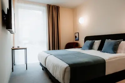 Ein Bett oder Betten in einem Zimmer der Unterkunft Moods Hotel Dortmund