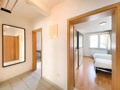 Ein Bett oder Betten in einem Zimmer der Unterkunft City Appartement