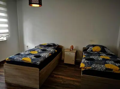 Ein Bett oder Betten in einem Zimmer der Unterkunft POLAT Apartments 3