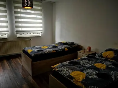 Ein Bett oder Betten in einem Zimmer der Unterkunft POLAT Apartments 3
