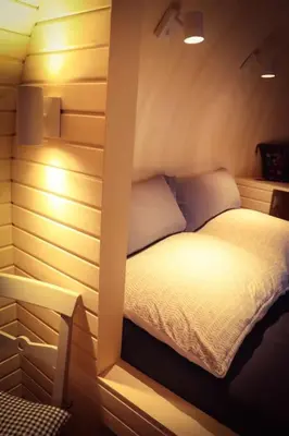 Ein Bett oder Betten in einem Zimmer der Unterkunft Tiny House Kotten Kunterbunt