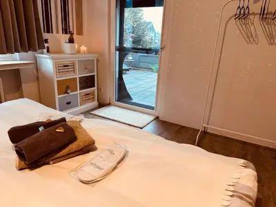 Ein Bett oder Betten in einem Zimmer der Unterkunft Whg 21 Ferienhaus mit Garten und Terrasse 130 qm