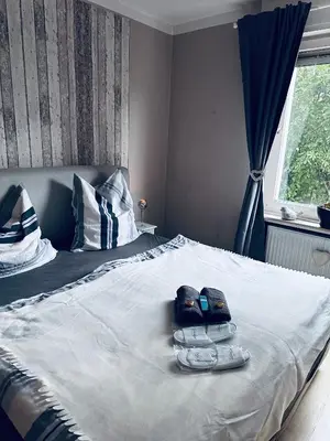 Ein Bett oder Betten in einem Zimmer der Unterkunft Whg 21 Ferienhaus mit Garten und Terrasse 130 qm