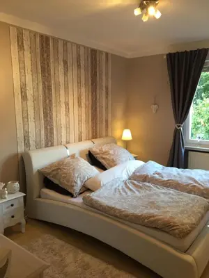 Ein Bett oder Betten in einem Zimmer der Unterkunft Whg 21 Ferienhaus mit Garten und Terrasse 130 qm