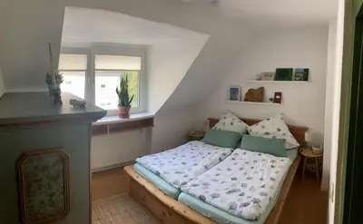 Ein Bett oder Betten in einem Zimmer der Unterkunft Ferienwohnung Amsel