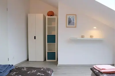 Ein Bett oder Betten in einem Zimmer der Unterkunft LIVING .... Bungalow mit großem Garten .