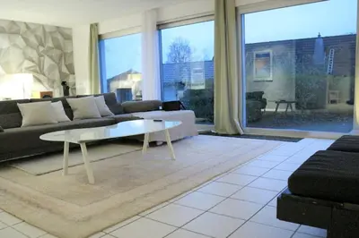 Ein Sitzbereich in der Unterkunft LIVING .... Bungalow mit großem Garten .