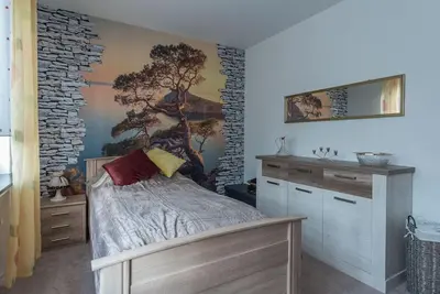 Ein Bett oder Betten in einem Zimmer der Unterkunft Schöne lichtdurchflutete Ferienwohnung mit Balkon