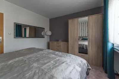 Ein Bett oder Betten in einem Zimmer der Unterkunft Schöne lichtdurchflutete Ferienwohnung mit Balkon