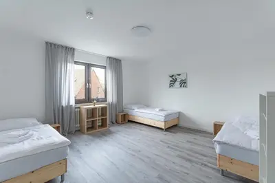 Ein Bett oder Betten in einem Zimmer der Unterkunft T&K Apartments-Comfortable 2 and 3 room apartments in Oberhausen