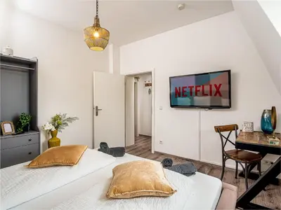 Ein Bett oder Betten in einem Zimmer der Unterkunft Fabelhafte Apartments zum wohlfühlen mit JUNIK Apartments