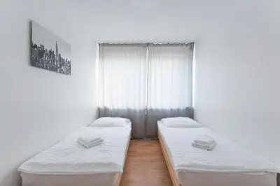 Ein Bett oder Betten in einem Zimmer der Unterkunft T&K Apartments - 3 Room Apartment