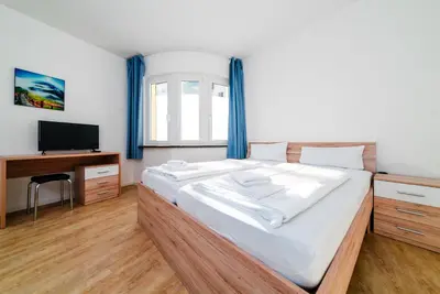 Ein Bett oder Betten in einem Zimmer der Unterkunft City Rooms Dortmund