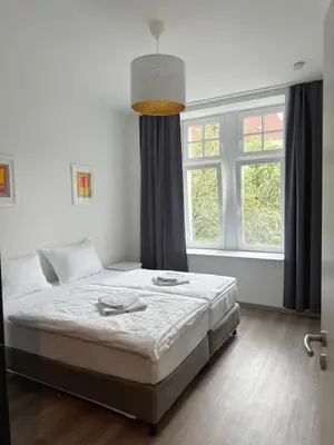 Ein Bett oder Betten in einem Zimmer der Unterkunft JayBnB - Modern eingerichtetes Apartment zentral in Dortmund