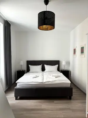 Ein Bett oder Betten in einem Zimmer der Unterkunft JayBnB - Modern eingerichtetes Apartment zentral in Dortmund