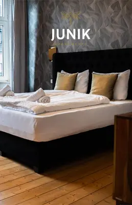 Ein Bett oder Betten in einem Zimmer der Unterkunft JUNIK Apartments - Deine Cityapartments in Duisburg
