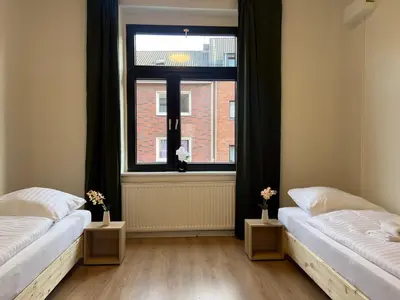 Ein Bett oder Betten in einem Zimmer der Unterkunft Duisburg - 2 Schlafzimmer Monteurwohnung - Vollausgestattete Küche - WIFI