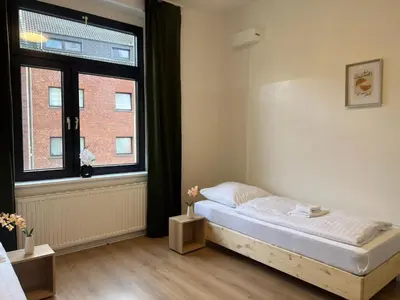 Ein Bett oder Betten in einem Zimmer der Unterkunft Duisburg - 2 Schlafzimmer Monteurwohnung - Vollausgestattete Küche - WIFI