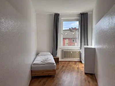 Ein Bett oder Betten in einem Zimmer der Unterkunft UNGLAUBLICHES ANGEBOT-Duisburg 4 Zimmer Apartment