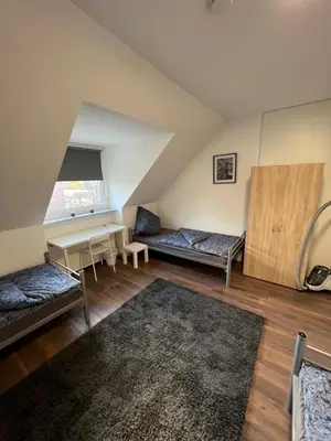Ein Bett oder Betten in einem Zimmer der Unterkunft Ewald