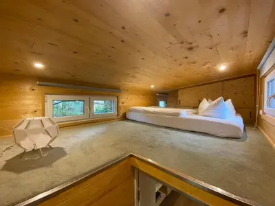 Ein Bett oder Betten in einem Zimmer der Unterkunft Tiny House Wupper im PIER9 Tiny House Hotel