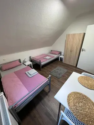 Ein Bett oder Betten in einem Zimmer der Unterkunft Hugo