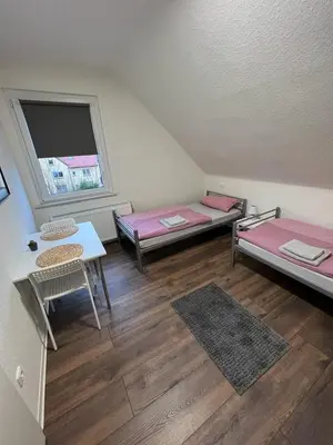 Ein Bett oder Betten in einem Zimmer der Unterkunft Hugo