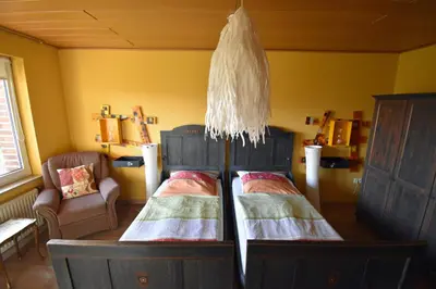 Ein Bett oder Betten in einem Zimmer der Unterkunft Kreativhof Lehmberg