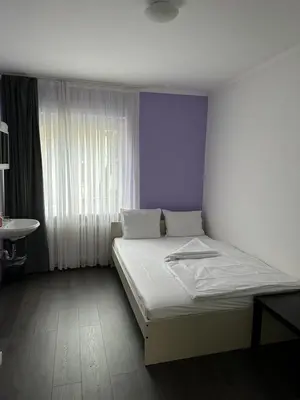 Ein Bett oder Betten in einem Zimmer der Unterkunft Hotel Annis M&P