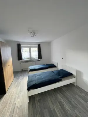 Ein Bett oder Betten in einem Zimmer der Unterkunft estrella24 LIVING ROOMS Chicago