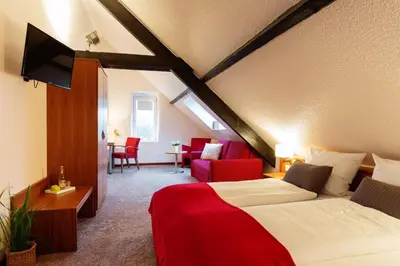 Ein Bett oder Betten in einem Zimmer der Unterkunft Hotel Das Kemperdick