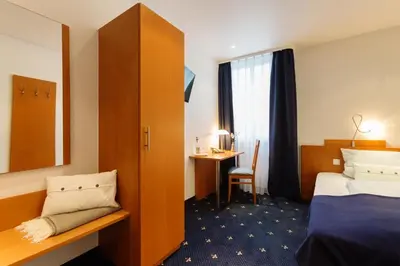 Ein Bett oder Betten in einem Zimmer der Unterkunft Hotel Das Kemperdick