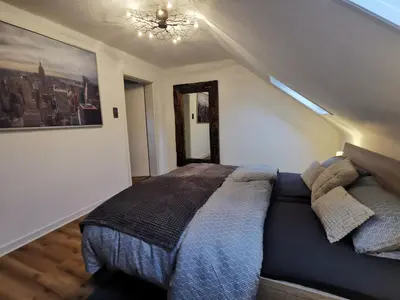 Ein Bett oder Betten in einem Zimmer der Unterkunft Moderne Ferienwohnung Iserlohn 1