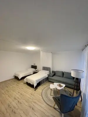 Ein Bett oder Betten in einem Zimmer der Unterkunft Ferienwohnungen Valerij